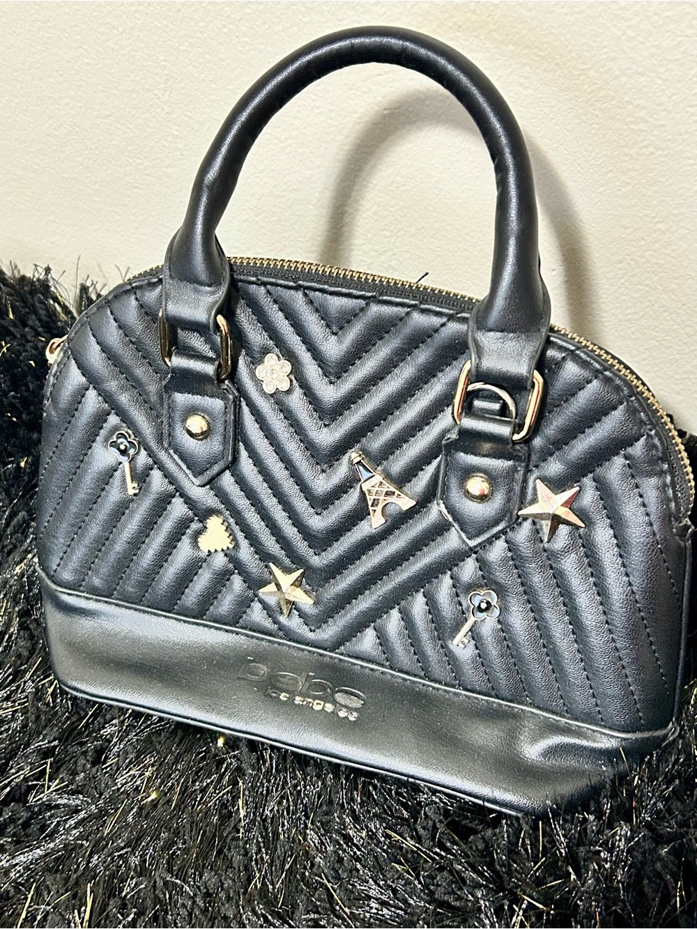 bebe Black Quilted Dome Satchel with Metal Charm Accents